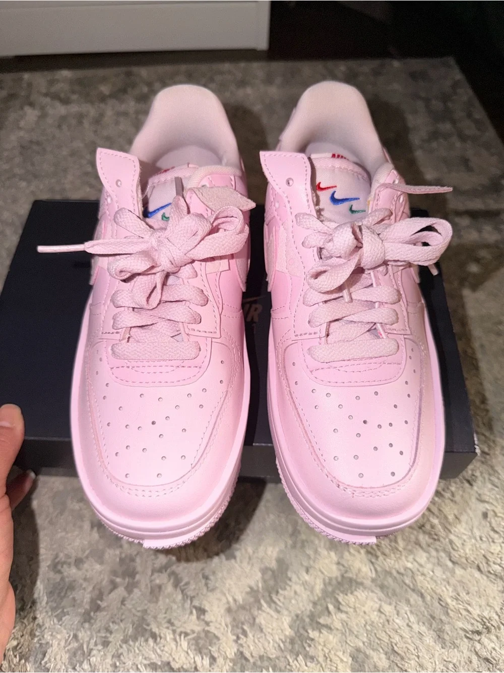 Nike Women’s Pink Sneakers with Red Heel Accent